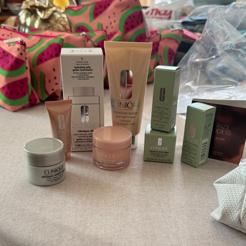 Clinique Skincare Collection with White Estée Lauder pouch, all NIB